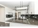 Stylish kitchen features granite countertops, stainless steel appliances, and open layout perfect for entertaining guests at 902 N Anderson St, Elwood, IN 46036