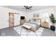 Stylishly staged main bedroom with neutral tones, natural light, and an en-suite bathroom, offering a serene retreat at 902 N Anderson St, Elwood, IN 46036