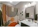 Bathroom featuring a modern vanity with white countertop, framed mirror, and shower with decorative curtain at 9539 Rocky Shore Dr, McCordsville, IN 46055