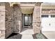 Front door with stone brick and a view looking at the door entrance at 9539 Rocky Shore Dr, McCordsville, IN 46055