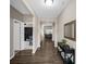 Inviting hallway with hardwood floors, leading to the living area and bedroom at 9539 Rocky Shore Dr, McCordsville, IN 46055