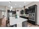 Modern kitchen featuring a large island, sleek cabinetry, and stainless steel appliances at 9539 Rocky Shore Dr, McCordsville, IN 46055
