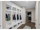 Convenient mud room with custom shelving, seating, and storage space at 9539 Rocky Shore Dr, McCordsville, IN 46055