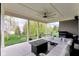 Covered outdoor patio featuring comfortable seating and a fire table for relaxing and entertaining guests at 9539 Rocky Shore Dr, McCordsville, IN 46055