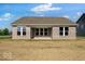 The backyard shows a brick house with large windows that gives a view from inside the house at 1023 Grassy Br Dr, Indianapolis, IN 46239