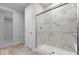 Bathroom featuring a tiled shower with glass doors at 1023 Grassy Br Dr, Indianapolis, IN 46239