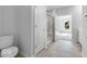 Bright bathroom featuring tile floors and tiled shower at 1023 Grassy Br Dr, Indianapolis, IN 46239