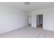 Bedroom with neutral carpet and white walls leads to a full bathroom, offering a convenient and private layout at 1023 Grassy Br Dr, Indianapolis, IN 46239