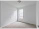 Bedroom features carpet flooring, a closet, and a window that brings in natural light to the room at 1023 Grassy Br Dr, Indianapolis, IN 46239