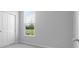 A serene bedroom offers carpet floors, a window for natural light and a double door closet at 1023 Grassy Br Dr, Indianapolis, IN 46239
