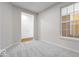 Bright bedroom featuring a window and carpeted floors at 1023 Grassy Br Dr, Indianapolis, IN 46239