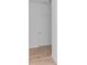 White door with silver hardware and light wood-look floors against a bright white wall at 1023 Grassy Br Dr, Indianapolis, IN 46239