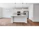 Modern kitchen with stainless steel appliances, granite countertops, and a large island with pendant lighting at 1023 Grassy Br Dr, Indianapolis, IN 46239