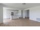 Open-concept kitchen featuring stainless appliances, a center island, and hardwood floors at 1023 Grassy Br Dr, Indianapolis, IN 46239