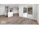 Modern kitchen island featuring granite countertops, stainless steel appliances, and a light wood floor at 1023 Grassy Br Dr, Indianapolis, IN 46239