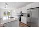 Modern kitchen featuring stainless steel appliances, an island with a sink, and granite countertops at 1023 Grassy Br Dr, Indianapolis, IN 46239