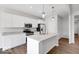 Bright kitchen featuring white cabinets, granite countertops, and stainless steel appliances at 1023 Grassy Br Dr, Indianapolis, IN 46239