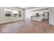 Well-lit open floor plan with a modern kitchen and plenty of natural light from large windows at 1023 Grassy Br Dr, Indianapolis, IN 46239