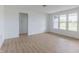 Sun-filled living room with large windows, hardwood floors, and neutral decor at 1023 Grassy Br Dr, Indianapolis, IN 46239