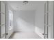 Bright office featuring French doors, a large window, and neutral carpet at 1023 Grassy Br Dr, Indianapolis, IN 46239
