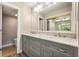 Elegant bathroom featuring double sinks, marble countertops, and a large mirror with vanity lighting at 108 Knoll Ct # A, Noblesville, IN 46062