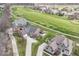 Aerial view showcases the neighborhood with lush green golf course at 10844 Fairwoods Dr, Fishers, IN 46037