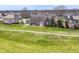 Aerial view of property overlooking lush backyard near a neighborhood golf course at 10844 Fairwoods Dr, Fishers, IN 46037
