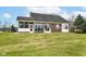 Expansive backyard with lush green lawn and brick patio, ideal for outdoor entertaining at 10844 Fairwoods Dr, Fishers, IN 46037