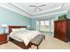 Spacious primary bedroom has a tray ceiling, bay window and bench, providing an airy and comfortable retreat at 10844 Fairwoods Dr, Fishers, IN 46037