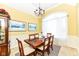 Dining room with large window and chandelier at 10844 Fairwoods Dr, Fishers, IN 46037