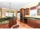 Stylish kitchen showcasing dark cabinets, granite countertops, and stainless steel appliances at 10844 Fairwoods Dr, Fishers, IN 46037