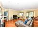 Hardwood floors and fireplace in an open-concept living room at 10844 Fairwoods Dr, Fishers, IN 46037