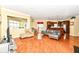 Open living room with hardwood floors, fireplace, and breakfast nook at 10844 Fairwoods Dr, Fishers, IN 46037