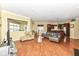 Bright, open living area with hardwood floors seamlessly connects the kitchen and living spaces at 10844 Fairwoods Dr, Fishers, IN 46037