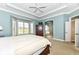 Airy main bedroom with bay window and access to the ensuite bathroom at 10844 Fairwoods Dr, Fishers, IN 46037