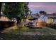 Private backyard with new deck, mature trees and hammock at 112 S Spencer Ave, Indianapolis, IN 46219