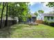 Serene backyard with a cozy deck, hammock, and lush greenery, creating a peaceful retreat at 112 S Spencer Ave, Indianapolis, IN 46219