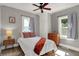 Charming bedroom with a ceiling fan, showcasing a bright and airy atmosphere with great natural light at 112 S Spencer Ave, Indianapolis, IN 46219