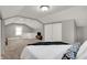 Spacious bedroom featuring a comfortable bed, carpet flooring, and a well-lit ambiance at 112 S Spencer Ave, Indianapolis, IN 46219