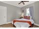 Comfortable bedroom with a ceiling fan, featuring a well-lit space and a cozy ambiance at 112 S Spencer Ave, Indianapolis, IN 46219