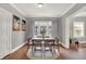 Charming dining room featuring hardwood floors and natural light at 112 S Spencer Ave, Indianapolis, IN 46219