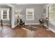 Bright living room featuring hardwood floors and a work space at 112 S Spencer Ave, Indianapolis, IN 46219