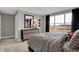 Bright bedroom with a large window offering natural light, complemented by a modern dresser and sporty football accents at 11599 Aubrey Ln, Fishers, IN 46040