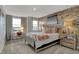 Charming bedroom features a brick accent wall, desk area, and comfortable furnishings at 11599 Aubrey Ln, Fishers, IN 46040