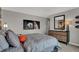 Stylish bedroom featuring neutral tones, grid-patterned bedding and sporty decorative accents for a modern aesthetic at 11599 Aubrey Ln, Fishers, IN 46040