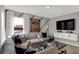 Bright living room with modern decor, decorative pillows, and a unique coffee table with glass top at 11599 Aubrey Ln, Fishers, IN 46040