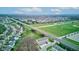 Expansive aerial view of a suburban community with lush green spaces and convenient access to nearby amenities at 12683 White Chapel Cir, Fishers, IN 46037