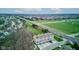 Aerial view of townhouse complex with neighboring homes, green space, and roads at 12683 White Chapel Cir, Fishers, IN 46037