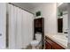 This bathroom features a toilet, vanity, mirror, and a shower tub with a shower curtain at 12683 White Chapel Cir, Fishers, IN 46037