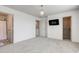 A carpeted bedroom featuring a chandelier and two doorways at 12683 White Chapel Cir, Fishers, IN 46037